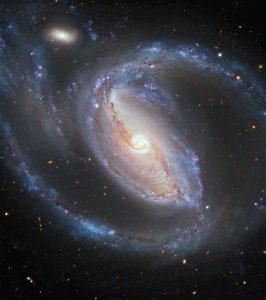 Arp-77-NGC-1097-a-barred-Seyfert-spiral-galaxy-and-NGC-1097A-the-small-elliptical-companion-about-50-million-light-years-away-in-Fornax-have-been-interacting-in-the-recent-past